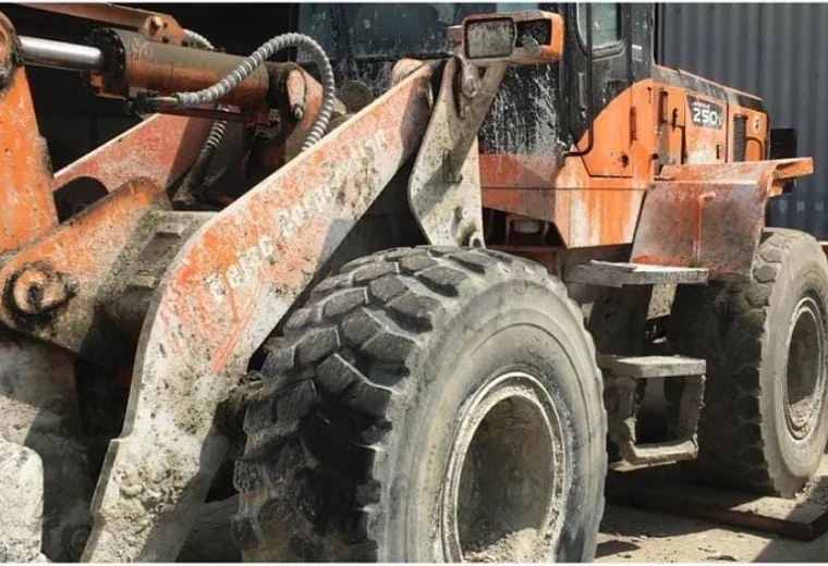 Orange wheel loader before restoration